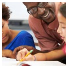 Teacher helping students